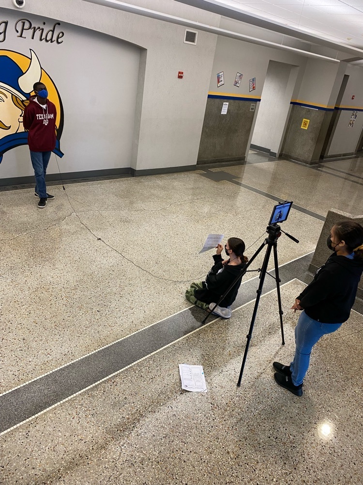 Students producing a feature segment about Community in Schools (CIS)