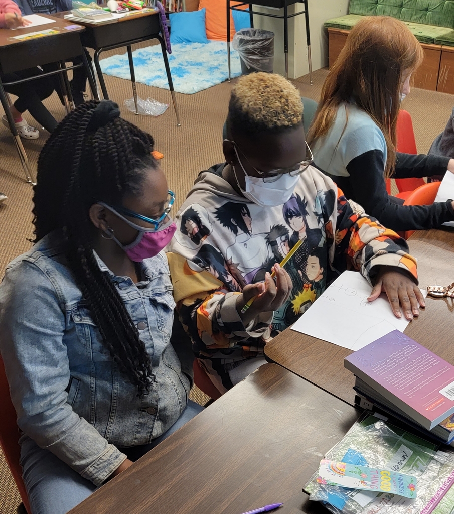 Jaqcen and Nevaeh working on their picture