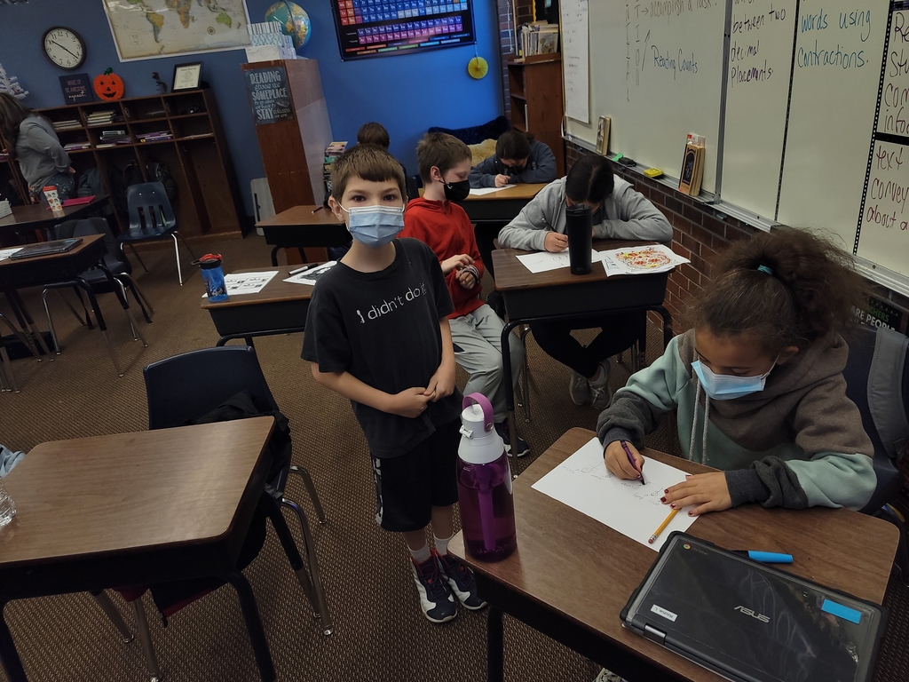 Caleb and Lylah working on their comic strip