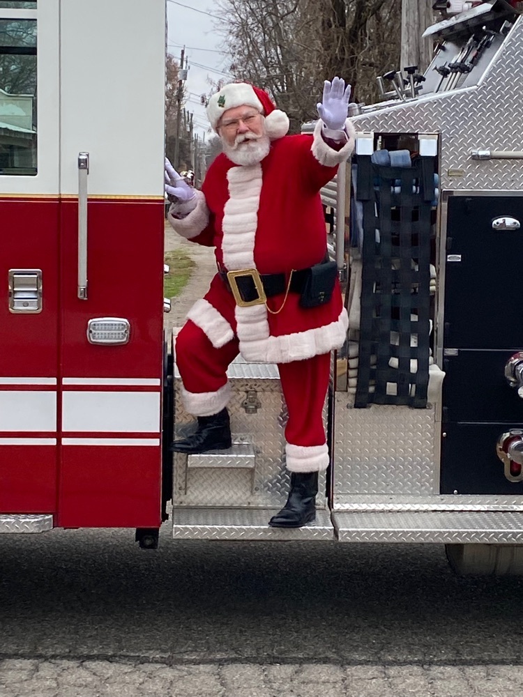 Santa waving at students 