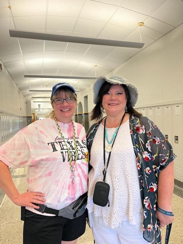 Mrs. Bartelli and Mrs. Woods showing their school spirit as Tacky Tourists at Parsons Middle School. 