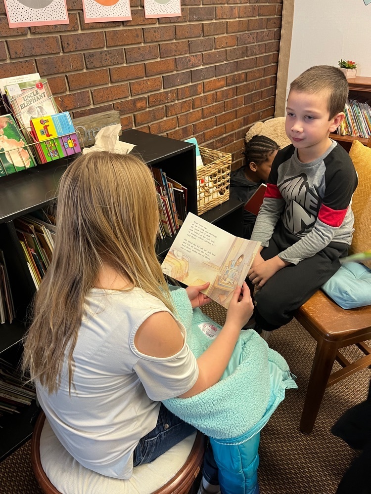 Fourth Graders reading to 1st graders 