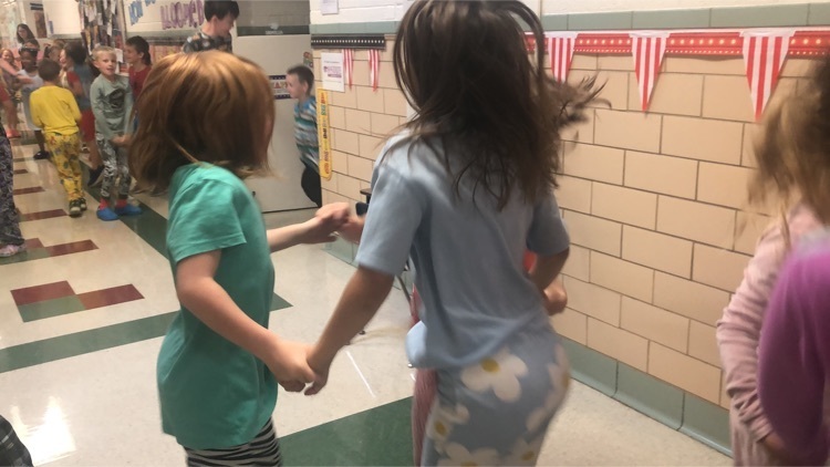 students dancing in the hallway 