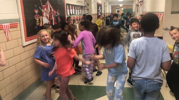 students dancing in the hallway