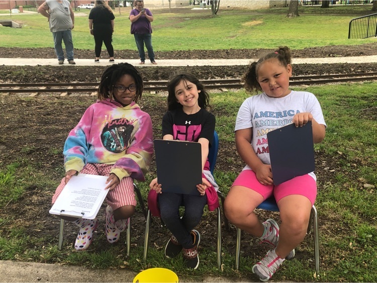students at the park ready to read