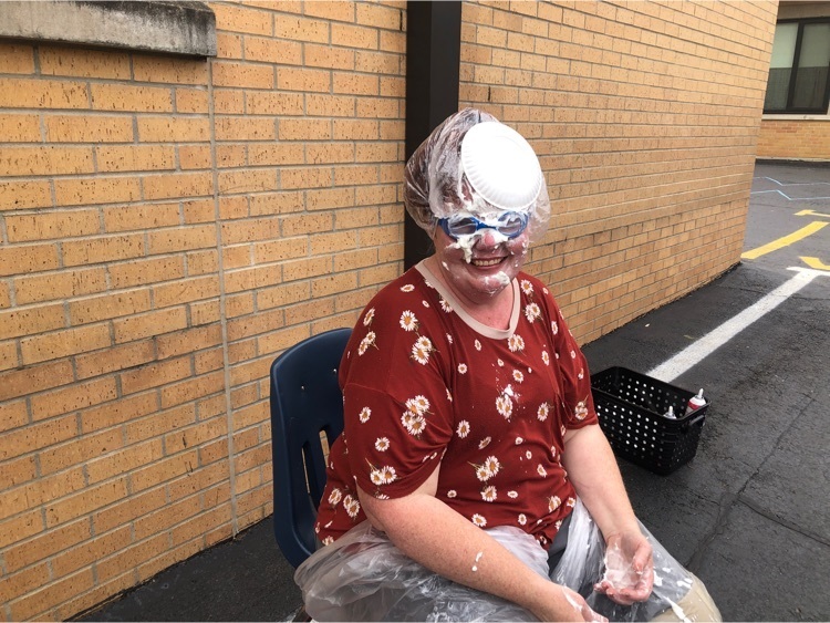 teacher with pie on he face and head