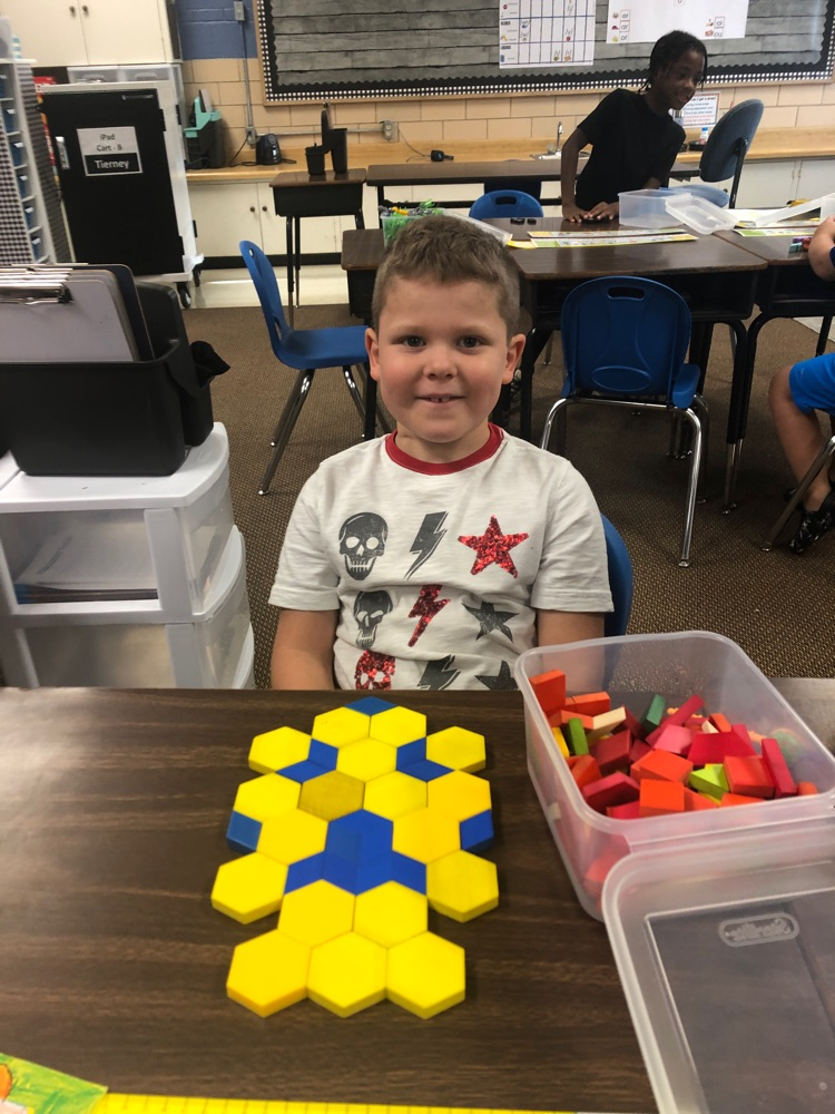 a boy with a pattern from yellow and blue blocks 