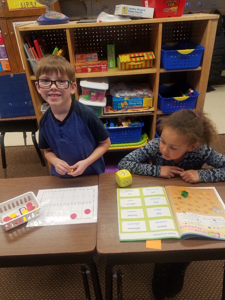Mrs.Newcomb's class playing with partners using ten frames. 